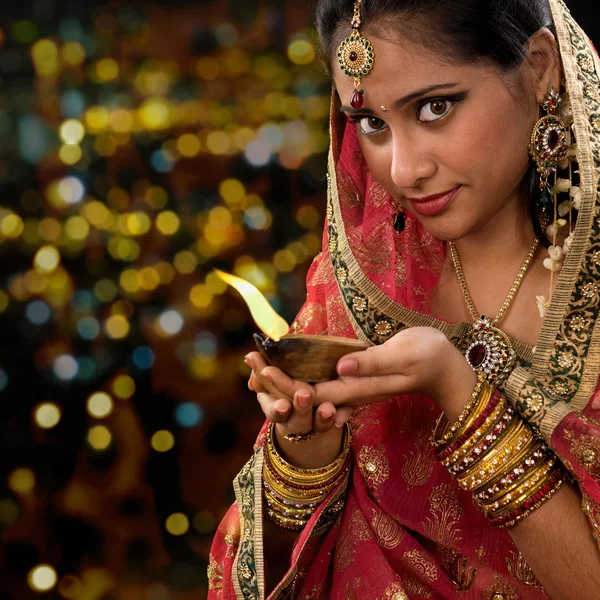 Indian woman hands holding diwali oil lamp — Stock fotografie