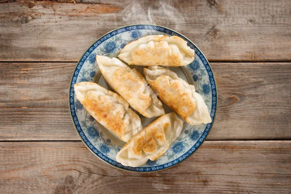 Asian appetizer pan fried dumplings — Stock Photo, Image