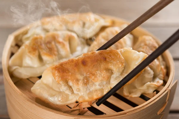 Chinese dish pan fried dumplings — Stock Photo, Image