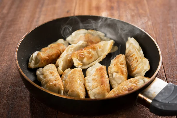 Fried dumpling in cooking pan — Stock Photo, Image