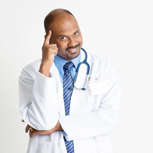 Thoughtful Mature Indian doctor — Stock Photo, Image