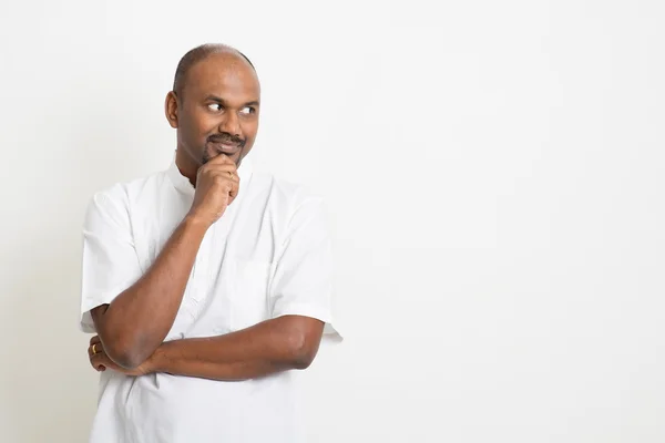 Mature Indian man looking side — Stok fotoğraf