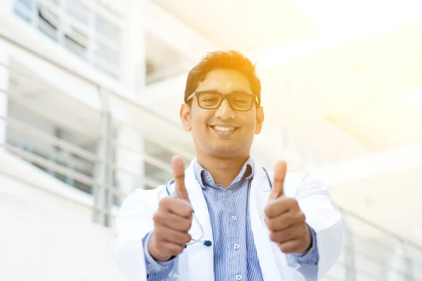 Asian Indian medical doctor thumbs up and smiling — Stok fotoğraf