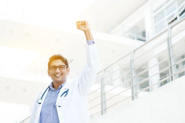 Excited Asian Indian medical doctor celebrating success — Stok fotoğraf