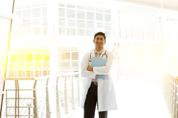 Asian Indian medical doctor holding medical report — Zdjęcie stockowe