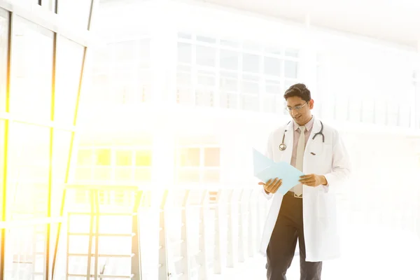 Asian Indian medical doctor walking at hospital corridor — Stok fotoğraf