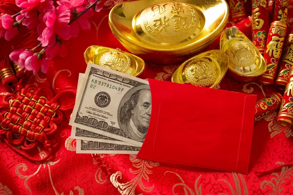 Chinese new year red envelope with dollars inside — стокове фото