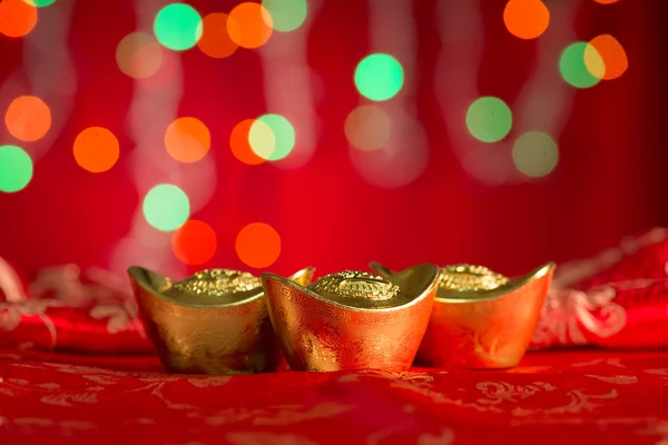 Chinese New Year decorations gold ingots with copy space — Stockfoto