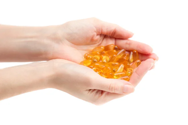 Omega 3 in female hands. — Stock Photo, Image