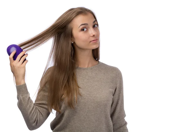 Young girl combing the studio. Isolate. — Stock Photo, Image