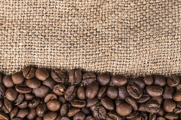 Background Coffee beans on canvas — Stock Photo, Image