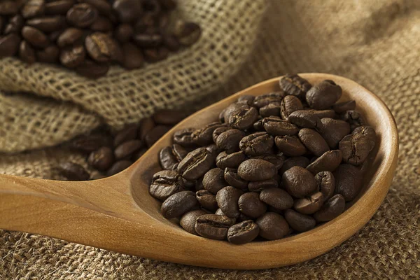 Coffee beans on burlap sack — Stock Photo, Image