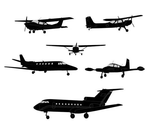 Flugzeugsilhouetten — Stockvektor