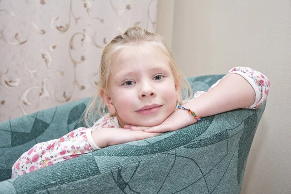 Little girl siting on a chair — Stock Photo, Image