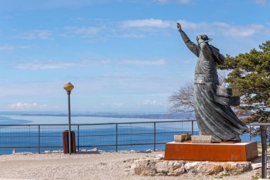 Trieste, Italy - March 7, 2020: Bronze Statue Italian Catholic Archbishop Antonio Santin at of Hill in Trieste, Italy.