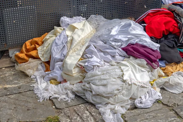 Big Pile of Discarded Clothing at Dump Site