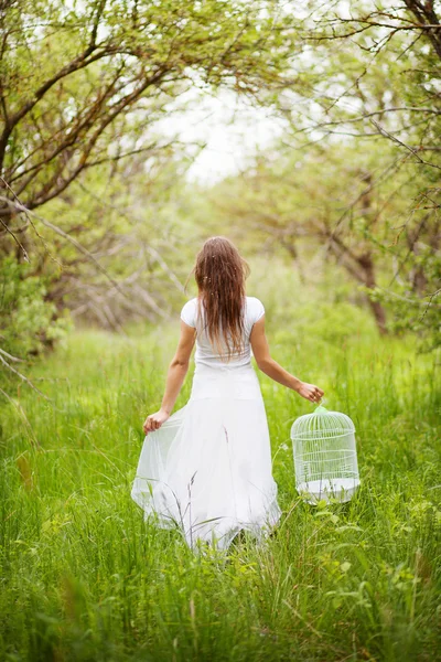 Girl with birdcage — Stock Photo, Image