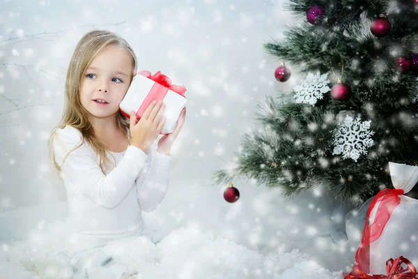 Beautiful girl with Christmas gift — Stock Photo, Image