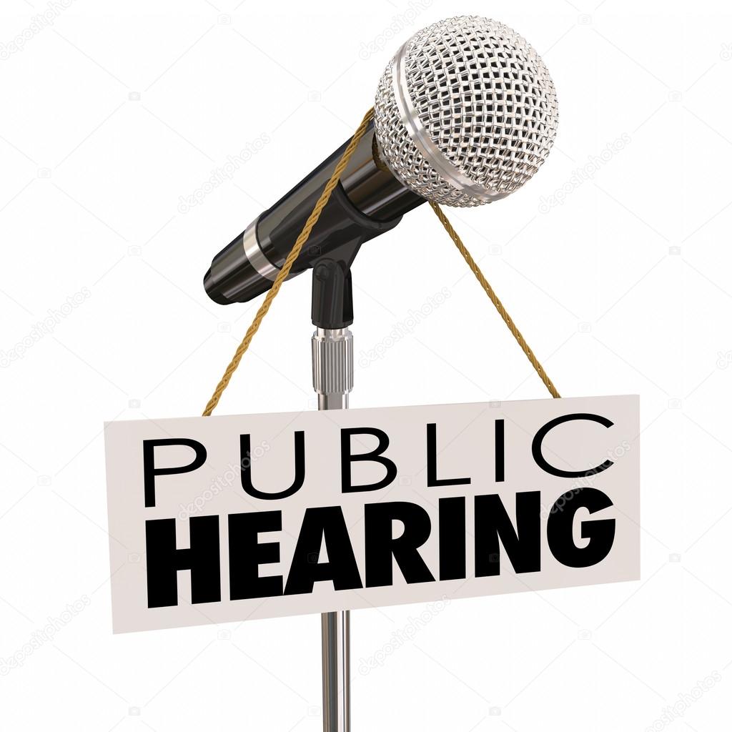 Public Hearing words on sign around a microphone