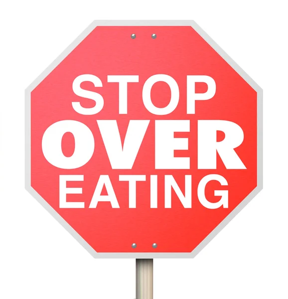 Stop Over Comer palabras en una señal roja de tráfico — Foto de Stock
