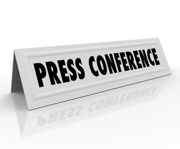 Press Conference words on a name tent card for speaker — Stock Photo, Image