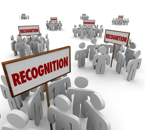 Recognition word on signs and groups of people — Zdjęcie stockowe