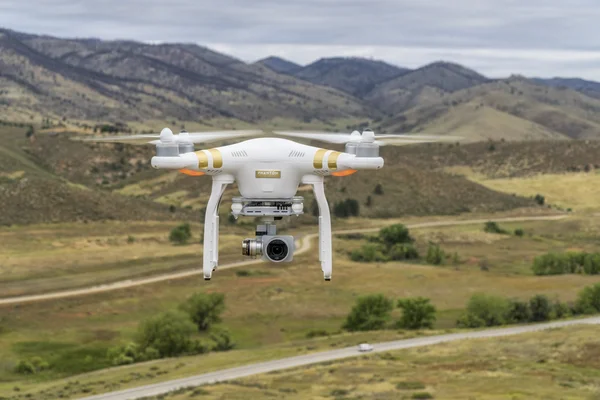 Phantom drone flying in mountains — Stock Photo, Image