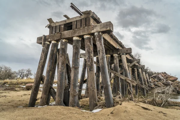 Destroyed railroad timber trestle — Stock Photo, Image