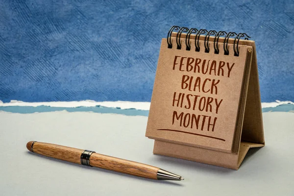 February - Black History Month, handwriting in a desktop calendar, an annual observance originating in the United States, where it is also known as African-American History Month