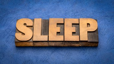 uyku - kelime soyut eski harf baskı ahşap türü, sağlıklı yaşam tarzı konsepti