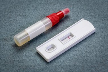 fecal immunochemical test for  colorectal diseases - home kit with a collecting tube and a negative result on a test cassette, health and self care concept clipart