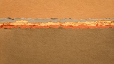 Pastel toprak tonlarında soyut bir manzara. El yapımı kağıt koleksiyonu.