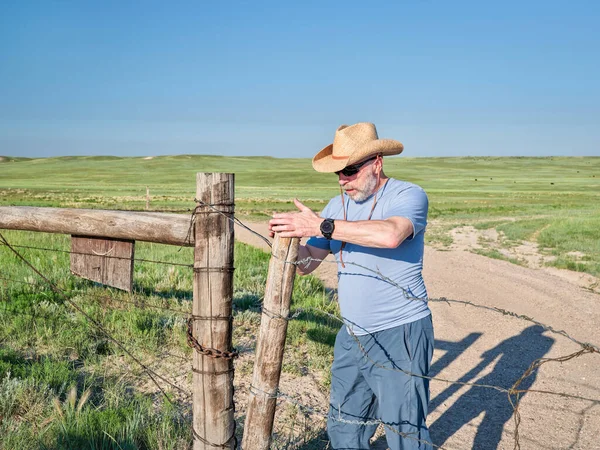 Senior Man Cowboy Hat Opening Closing Cattle Barbed Wire Gate — Stock Photo, Image