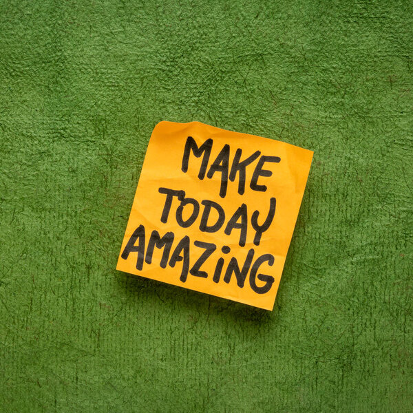Make today amazing reminder - handwriting on a sticky note against green textured paper, positivity, optimism and lifestyle concept