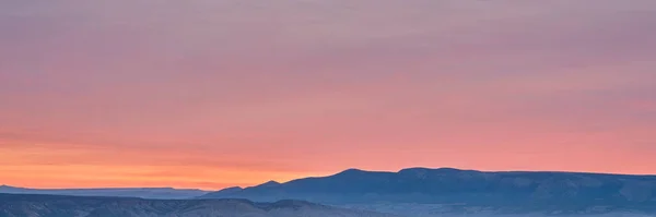 colorful sky over foggy Yampa River at dawn near Dinosaur National Monument in north western Colorado, panoramic web banner