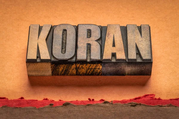 koran - word abstract in vintage letterpress wood type, the Islamic sacred book, believed to be the word of God