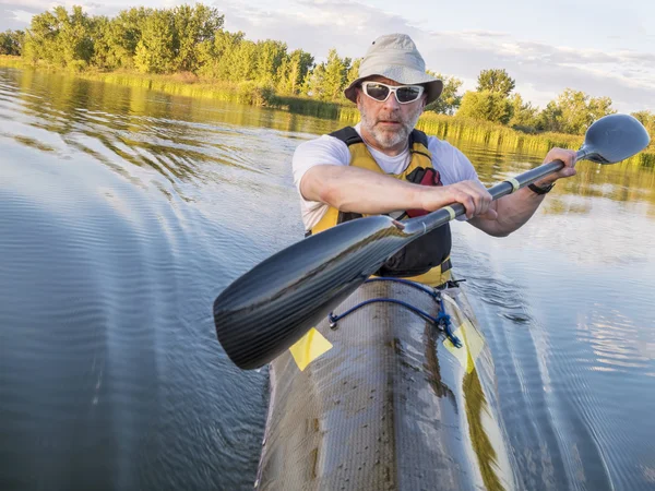 Paddling fast sea kayak — Stock Photo, Image