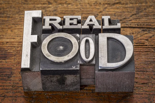 Real food text in metal type — Stock Photo, Image