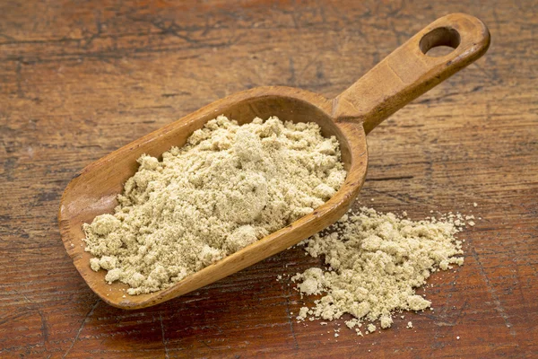 Scoop of rice bran — Stock Photo, Image