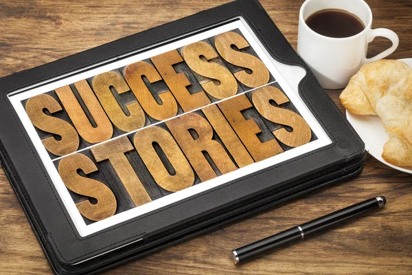 Success stories on digital tablet — Stock Photo, Image