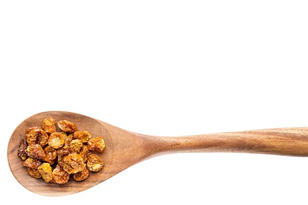 Bacche d'oro secche su cucchiaio di legno — Foto Stock