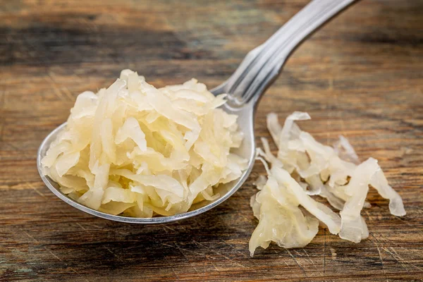 Tablespoon of sauerkraut — Stock Photo, Image