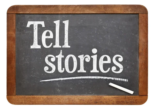 Tell stories advice on blackboard — Stock Photo, Image