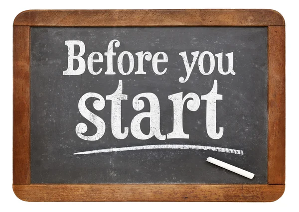 Before your start blackboard sign — Stockfoto