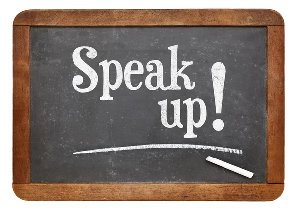 Speak up motivational phrase on blackboard — Stockfoto