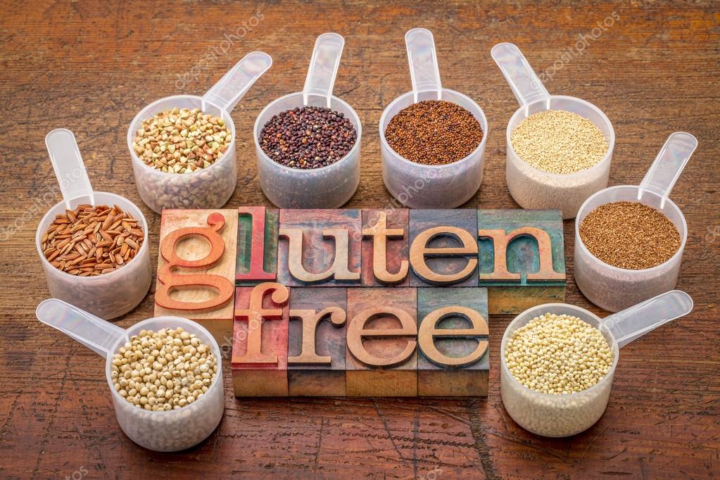 Scoops gluten free grains and text in wood type — Stock Photo
