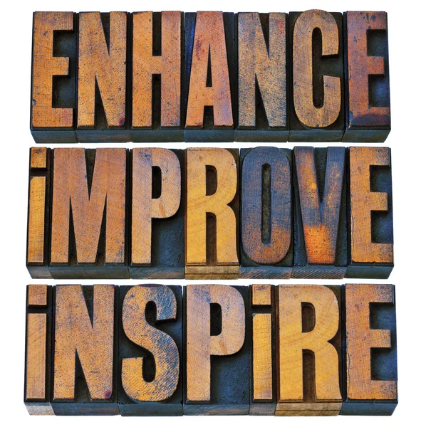 Enhance, improve, inspire in wood type — Stock Photo, Image