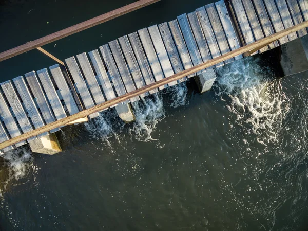 River diversion dam with foothbridge — 스톡 사진