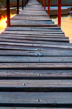footbridge over river at sunrise