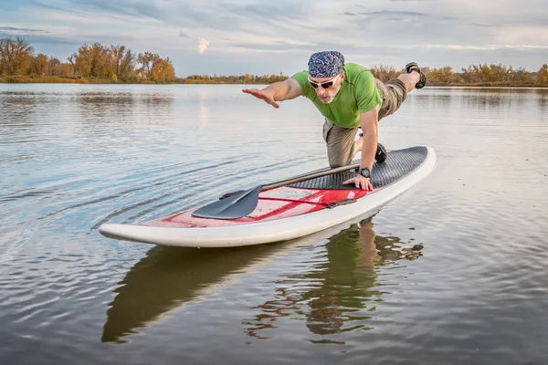 Fitness on stand up paddleboard — Stock Photo, Image